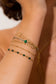 Multiple white thread bracelets