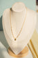 Pearl necklace with clover pendant