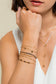 Multiple white thread bracelets