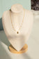 Pearl necklace with clover pendant