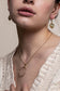 Gold circle and bar necklace