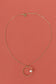 Golden chain necklace with circle and pearl