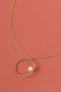Golden chain necklace with circle and pearl