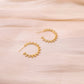 Golden hoop earrings spikes