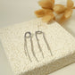Silver bow dangling earrings