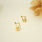 Boucles d'oreilles dorées avec perle