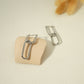 Dangling golden earrings