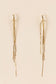 Dangling golden earrings