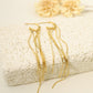 Dangling golden earrings