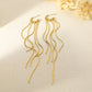 Dangling golden earrings