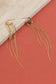 Dangling golden earrings