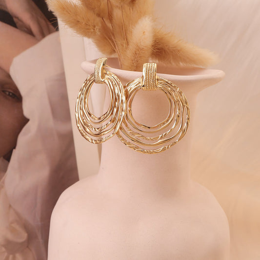 Boucles d'oreilles dorées rondes