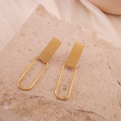 Golden dangling earrings