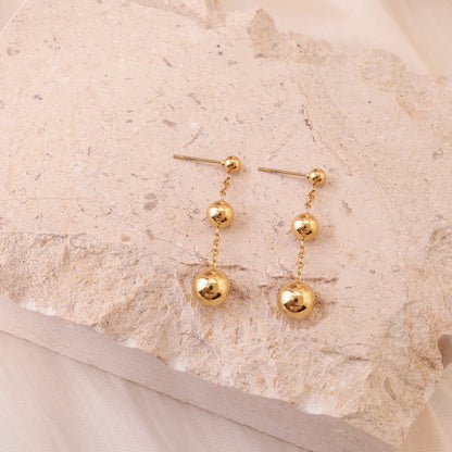 Golden triple ball earrings