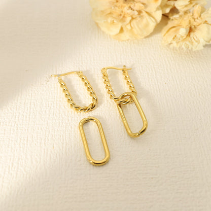 Dangling golden earrings