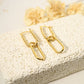 Dangling golden earrings