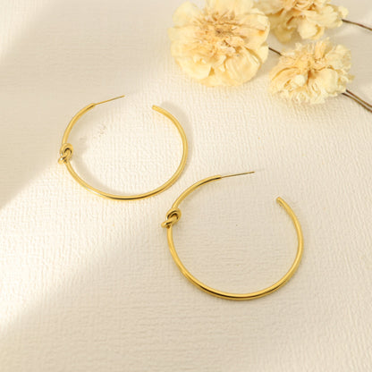 Boucles d'oreilles dorées cercles avec nœud