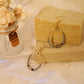 Drop earrings with sun in white stones