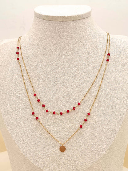 Collier double chaîne avec perles rouges