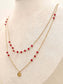 Collier double chaîne avec perles rouges