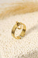 Golden ring with a pendant