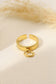 Golden ring with a pendant