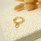 Golden ring with a pendant
