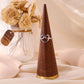 Golden heart ring with strikethrough