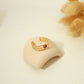 Triple line golden ring with red stone