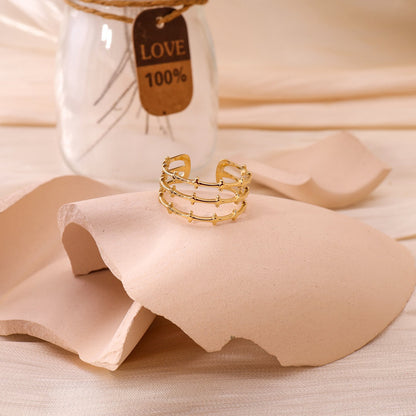 Gold multi line ring with dots