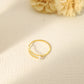 Golden double line ring with a pearl