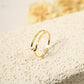 Golden double line ring with a pearl