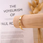 Smooth golden bangle bracelet