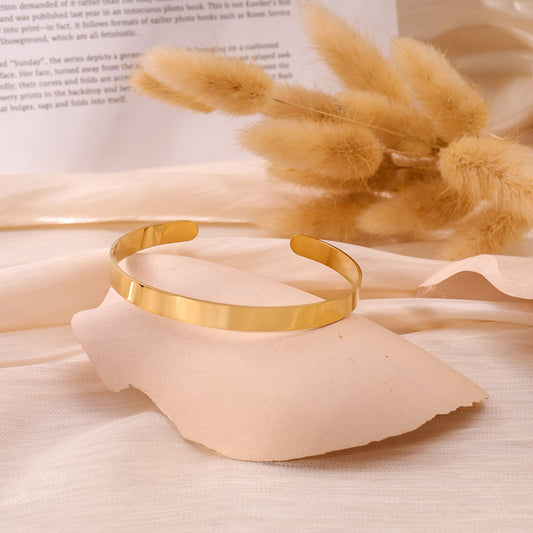 Smooth golden bangle bracelet