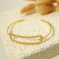 Bracelet jonc doré rectangle long