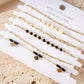 Multiple brown diamond bracelets