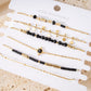 Multiple bracelets gray pearls