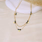 Collier double chaîne pierres vertes dorée