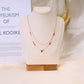 Collier double chaîne pierres vertes dorée