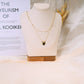 Double chain necklace with red pendants