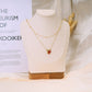 Double chain necklace with green pendants