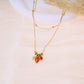 Double chain necklace with green pendants
