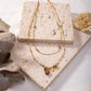 Double chain necklace with green stone