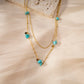 Double chain necklace with 5 golden green stones