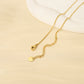 Golden necklace with pink pearls