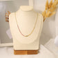 Golden necklace with pink pearls
