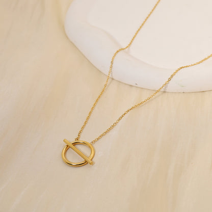 Golden crossed circle necklace