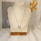 Golden crossed circle necklace