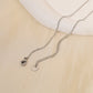 Golden crossed circle necklace