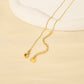 Collier chaîne dorée en Y avec perle en fleur